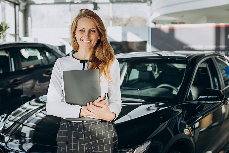 Sales woman in a car shworoom